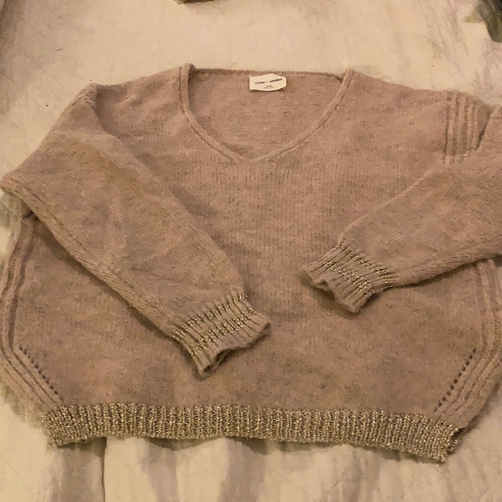 Soft knit sweater with metallic gold accents